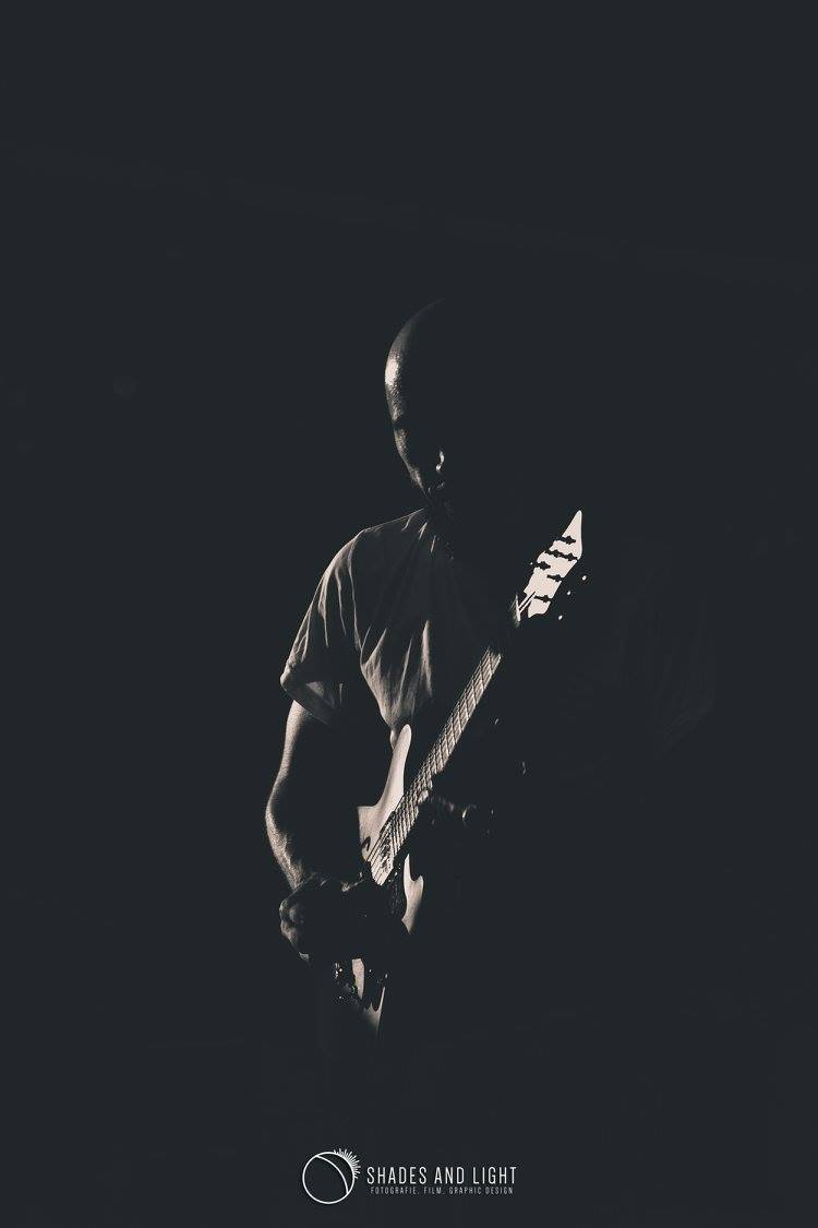 Cyfer silhouette with guitar